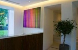 Brighten up a foyer or entrance with a bold piece of artwork.
